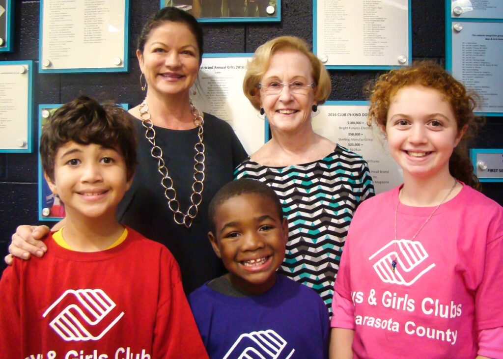 Jonna Keller (back left) and Alexandra Armstrong (back right) pictured with children from the Boys & Girls Clubs of Sarasota County.
